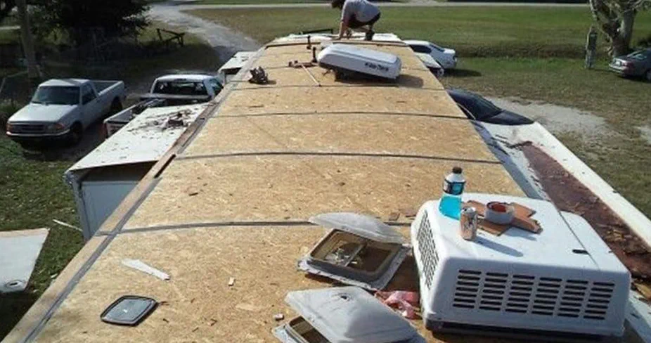Marcus Reyes performing a detailed RV roof inspection at a storage facility in Miami-Dade