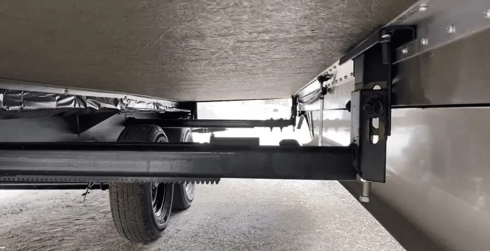 Marcus Reyes diagnosing an HWH hydraulic slide system on a Class A motorhome in Miami